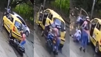 En video | Mujer se cayó de su moto, taxista se bajó a socorrerla y terminó causando un accidente peor - Infobae